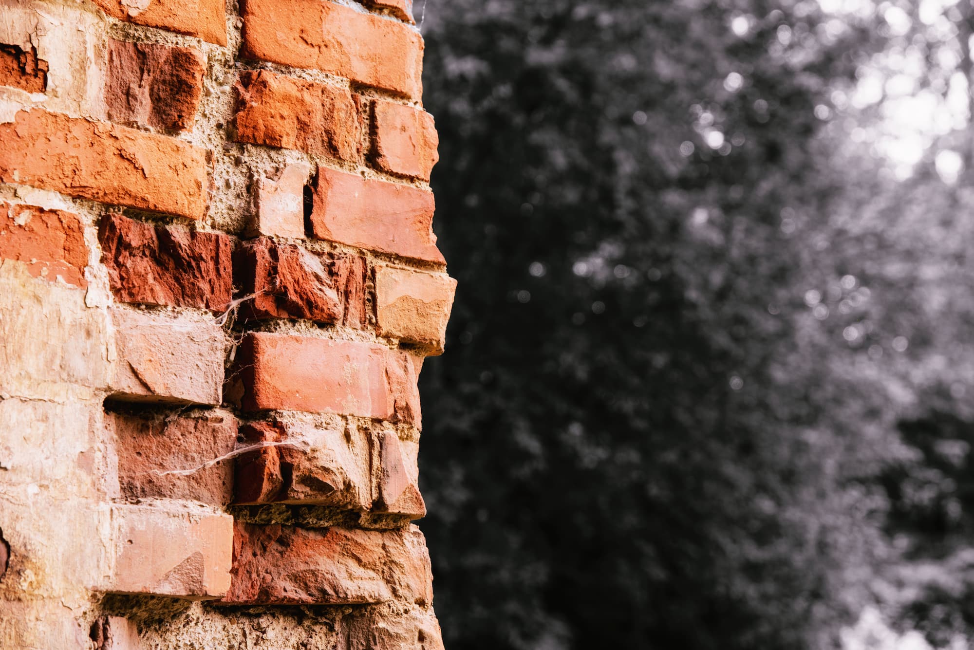 photo of a brick wall that needs repair